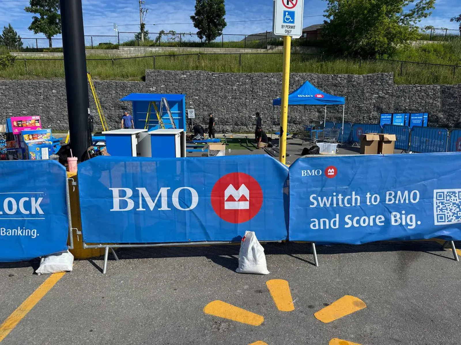 Event barriers holding back a line of people in Toronto.
